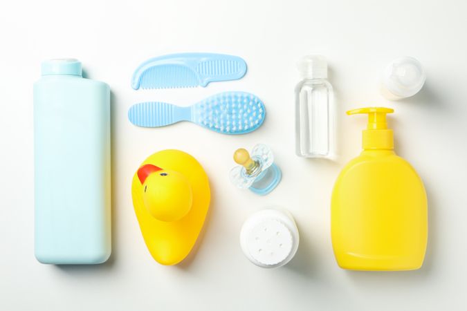 Flat lay with baby hygiene accessories on light background