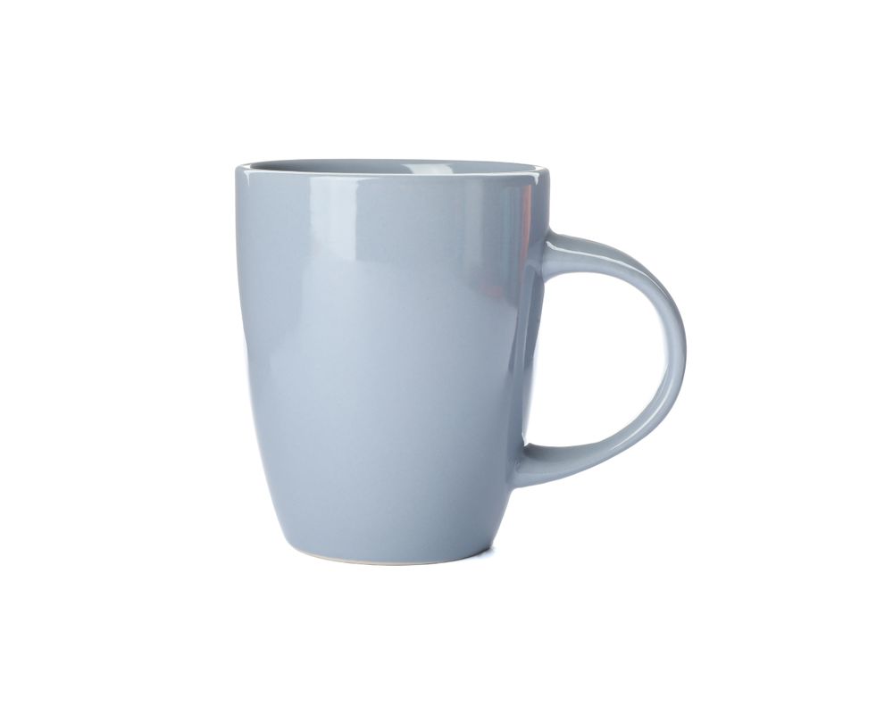 Empty ceramic cup isolated on studio background