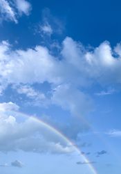 Half of a rainbow in the sky