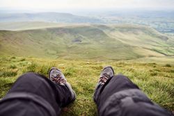 Two feet looking over the mountains