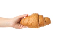 Female hand holding croissant, isolated on blank background