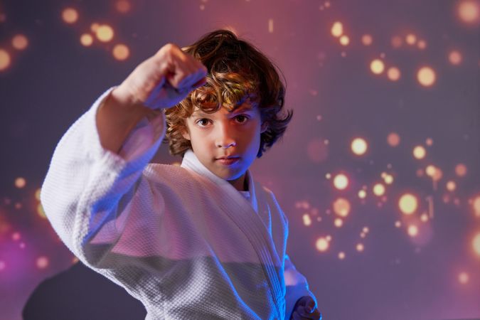 Boy in kimono practicing martial art