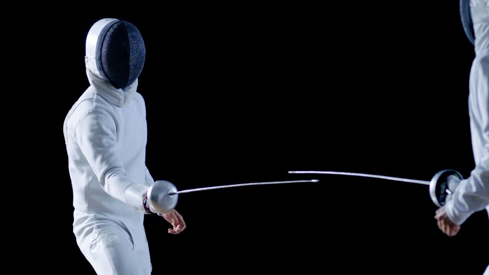 Two Professional Fencers Show Masterful Swordsmanship in their Foil Fight.