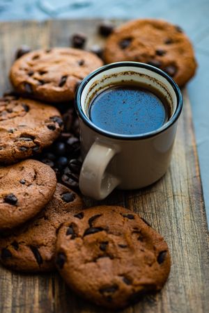 Coffee surrounded by cookies