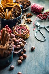 Christmas food concept or dried slices, nuts and cinnamon