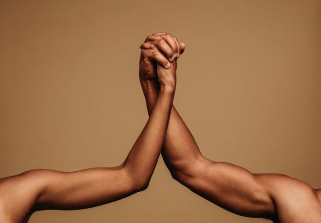 Male and female hands holding each other