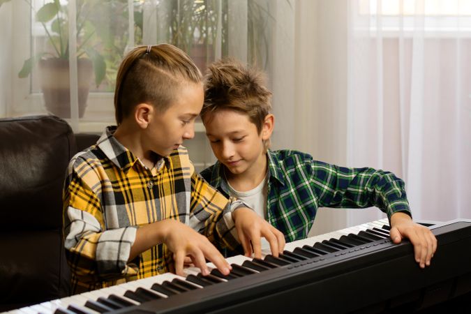 Brothers Practicing Piano Together