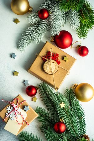 Top view of counter with fir branch and holiday baubles