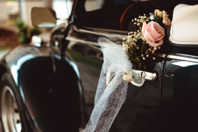 Flower on handle of retro car