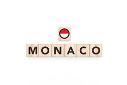 Wooden blocks bearing the name and flag of Monaco.