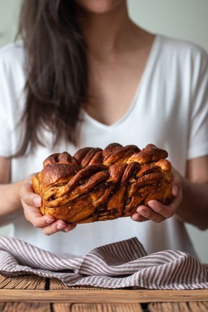 Faceless woman with appetizing cinnamon babka