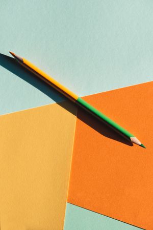 double-ended colored pencil on geometric  background