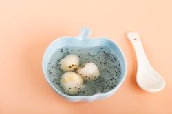 Bowl of sarang burung, canned lychee pudding with basil seed with spoon
