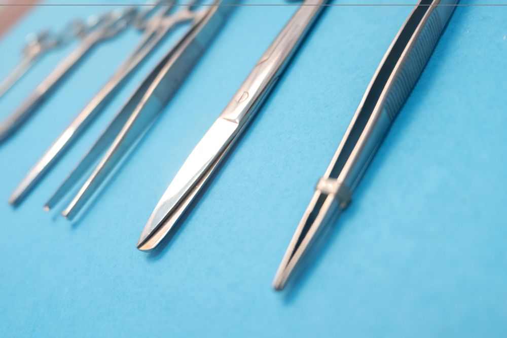 Set of Surgery Instrument over blue background, Scissors and forceps