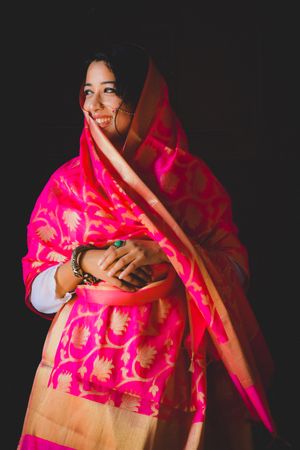 Woman wearing pink and brown Sari