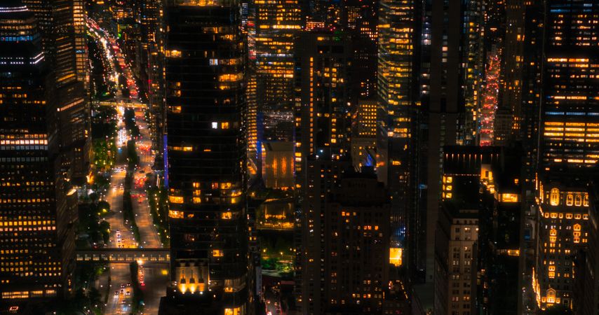 Helicopter Tourist Tour Around New York City at Night. Aerial View with a Picturesque Illuminated Office Buildings, Scenic View with Manhattan Skyscrapers Panorama