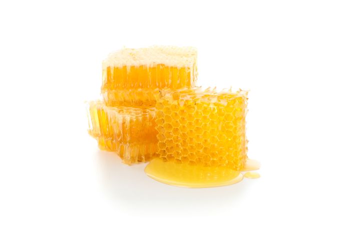 Pieces of honeycomb isolated on blank background, close up