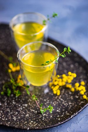 Close up of two glasses of limoncello with garnish