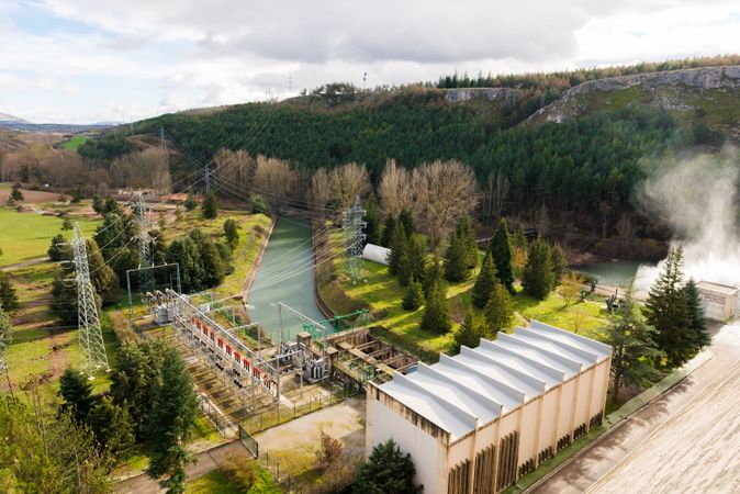 Contemporary hydroelectric power station in landscape