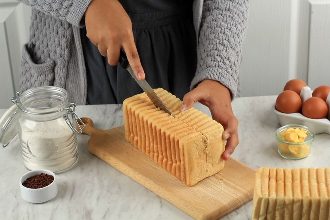 Female Hand Cut Slice Roti Bakar Bandung or Bandung Bread Toast