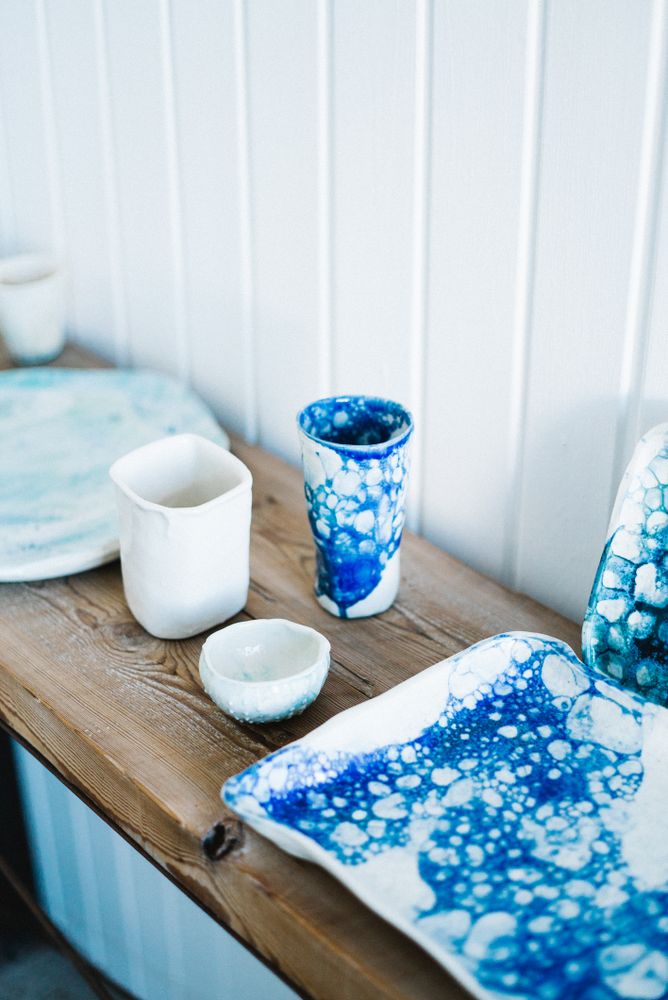 Shelf of ceramic objects in artisanal shop