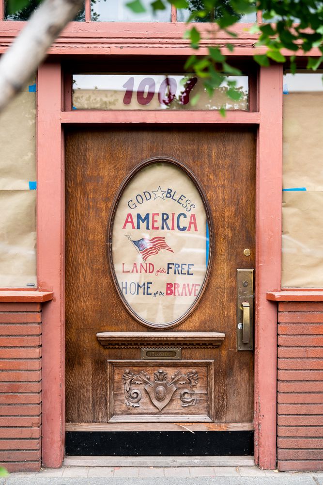 Restaurant door with “God Bless America” sign