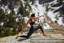 Young woman exercising on a snowy mountain 5zrng5