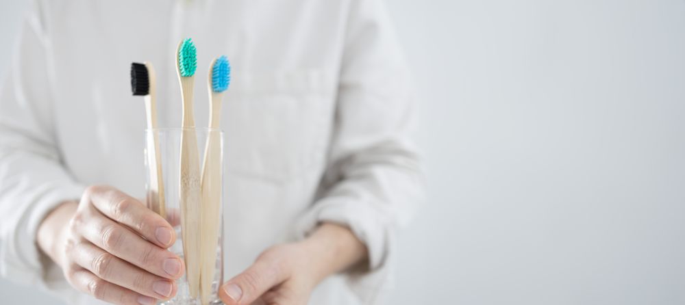 Bamboo toothbrushes in glass
