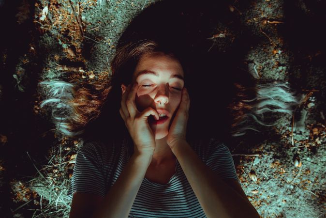 Woman lying on ground