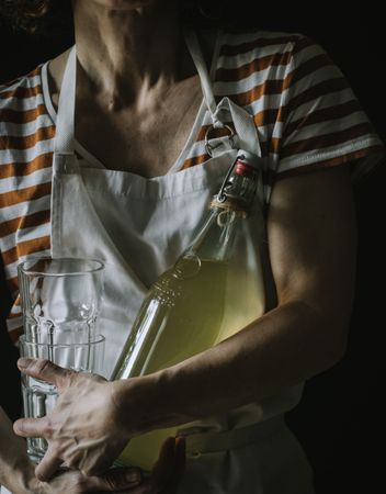 Female with bottle of elderflower syrup