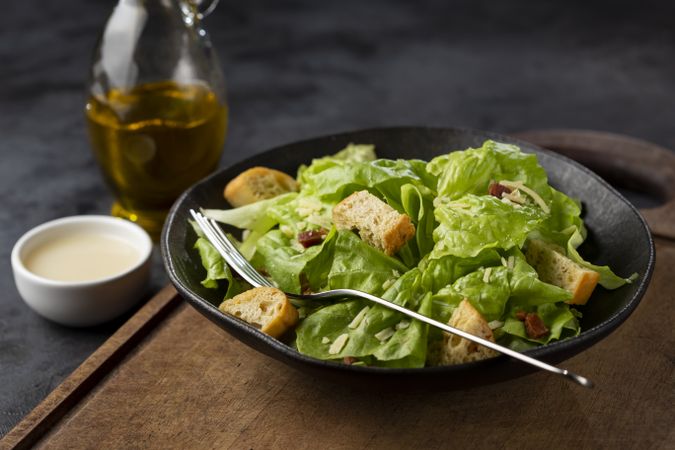 Caesar salad with croutons and bacon.