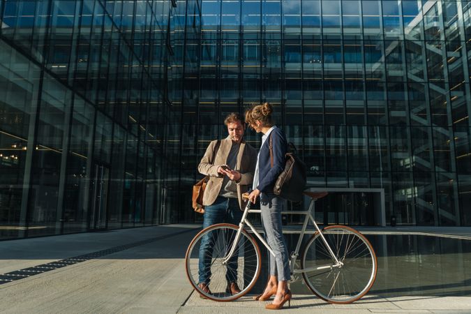 Businesspeople talking on street after work