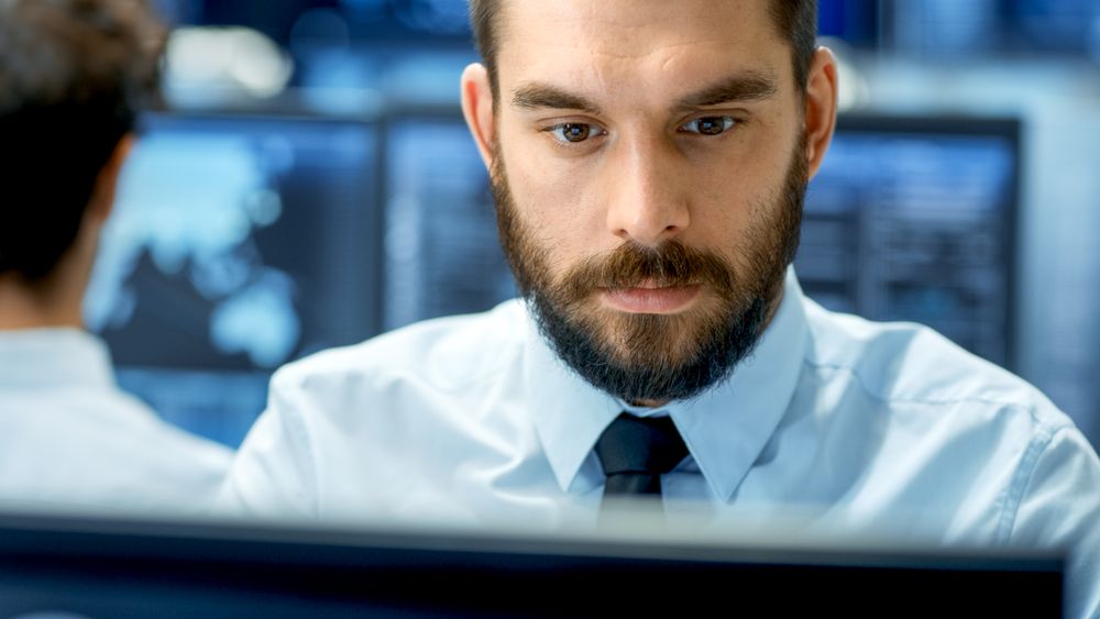 Neural Network and Machine Learning Engineer Working Hard at His Workstation.