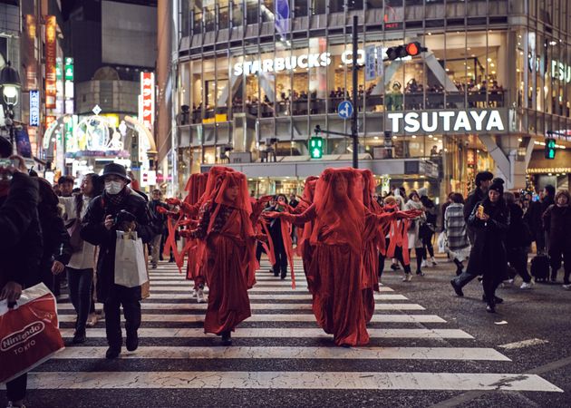 Japan - Tokyo, Shibuya Japan - November 29th, 2019: Red Rebel Brigade with arms outstretched