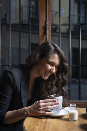 Young female with tea cup in cafe