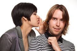 Couple Whispering Secrets To Each Other