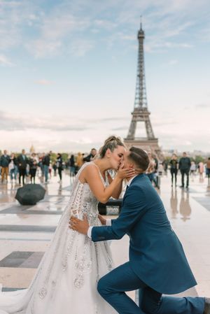 Happy newlyweds in wedding clothing kissing