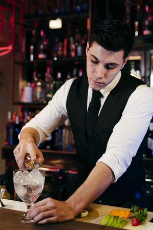 Barman working making drinks