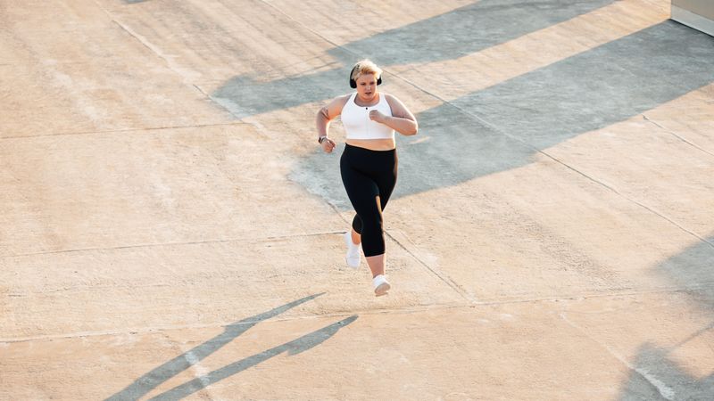 Athletic female doing cardio training outdoors