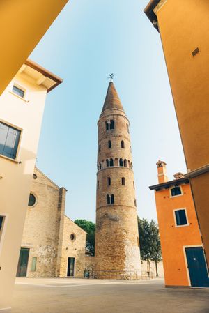 Cathedral bell tower in Caorle town in Italy