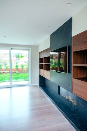 Living room with fireplace and TV