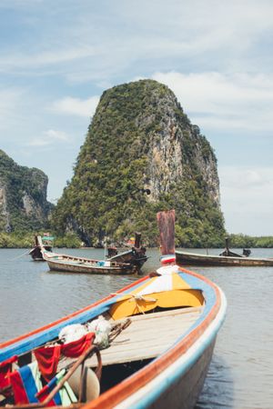 Traditional boats floating in tropical bay