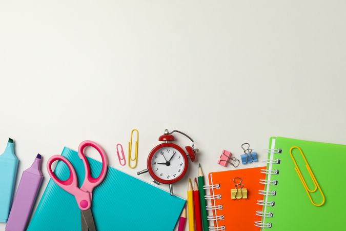Frame of school supplies on plain background, space for text