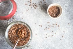 Top view of jar of whole flax seeds