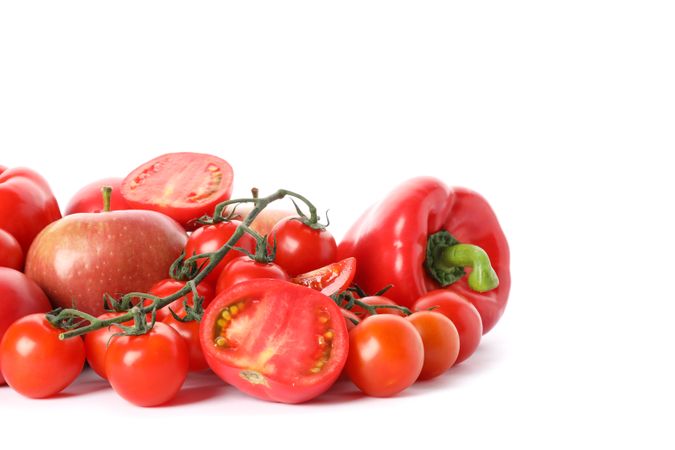 Tomatoes, apples and peppers isolated on plain background