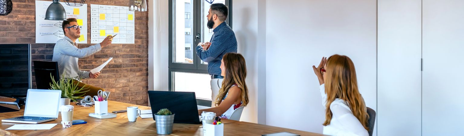 Team leader organizing work in an office