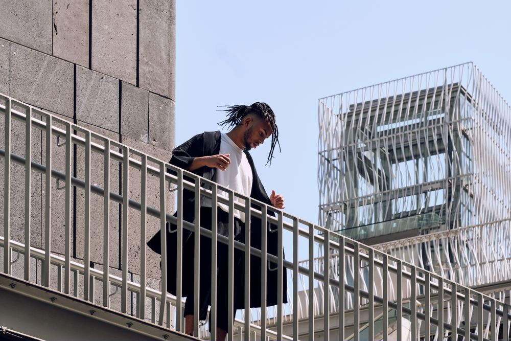Black male standing on bridge