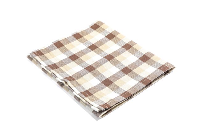 Folded fabric napkin isolated on plain background