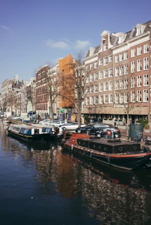 Boats anchored along river in Holland