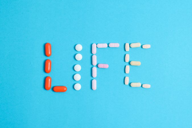Pills spelling out the word "LIFE" 
